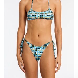 Triangl bikini in perfect condition with matching bag. Large top and xs bottoms.